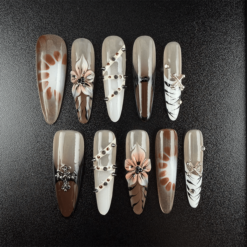 48 - Noah-UlightCoffee nude stiletto press on nails with zebra stripes and metallic charms