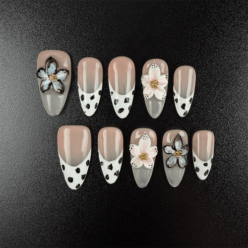 Almond cow print press-on nails with nude French tips