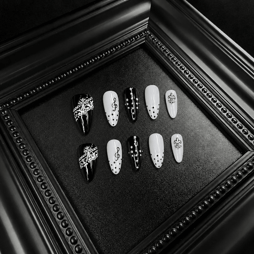 Black and white almond nails with lace and treble clef details
