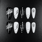 Black and white almond press-on nails with music note design