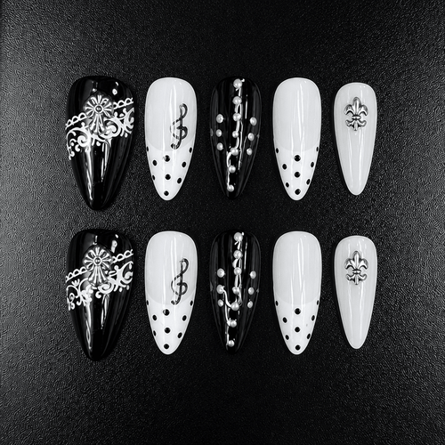 Black and white almond press-on nails with music note design