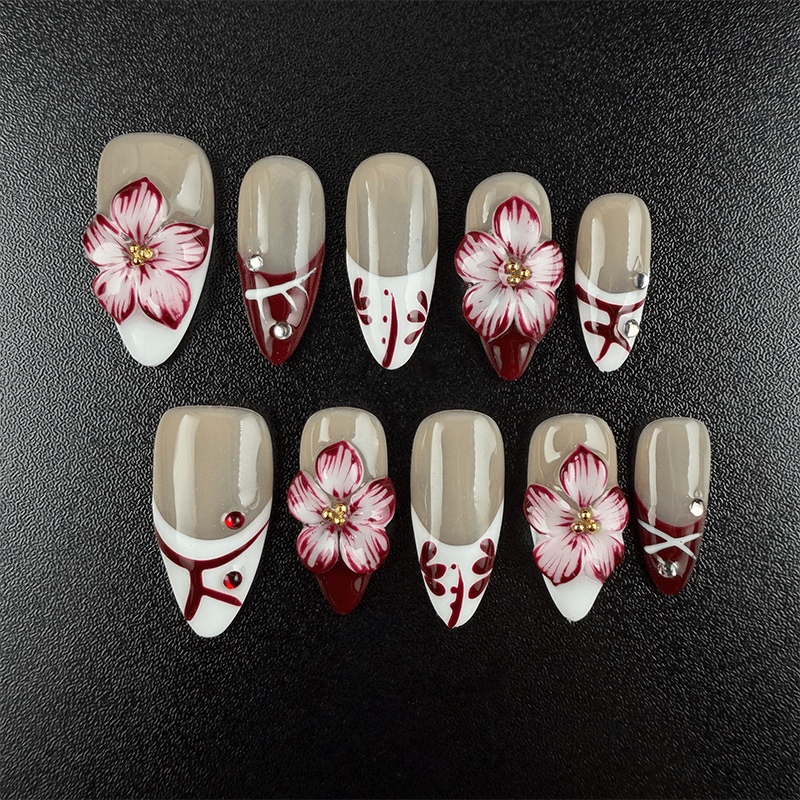 Burgundy floral almond press on nails with white French tips and rhinestones