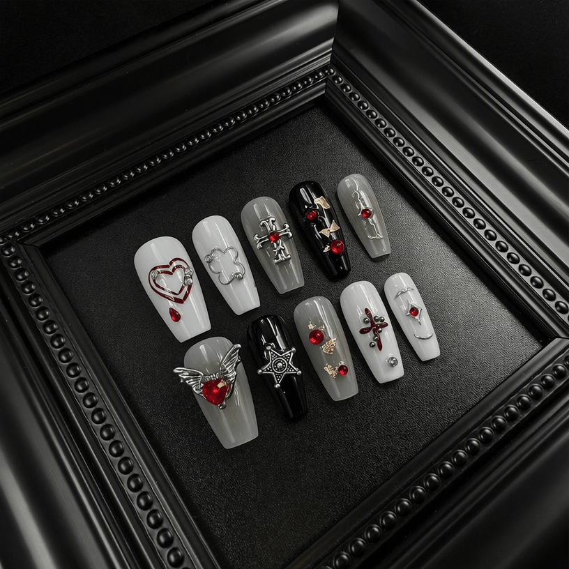 3D gothic press-on nails with red gems and chrome charms