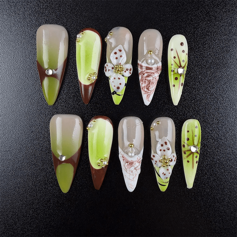 Matcha green stiletto press-on nails with floral details