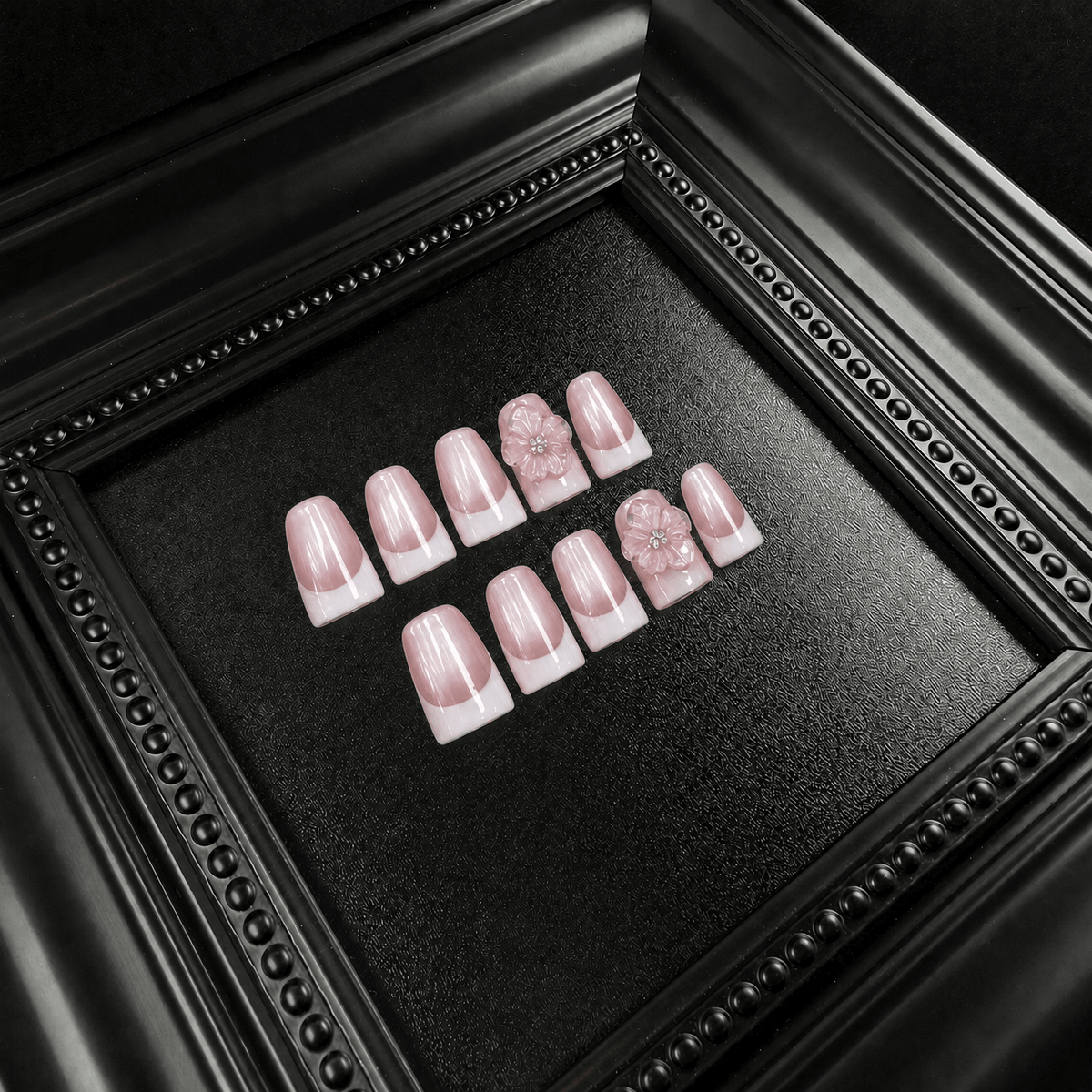 Short square pink press-on nails with floral details